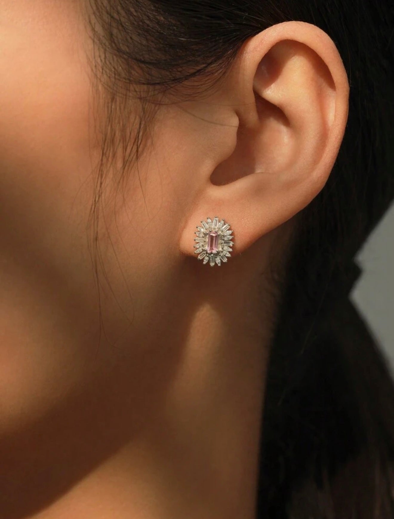 Fashionable luxury 925 sterling silver jewelry with pink sapphire. The set includes a pendant and earrings.