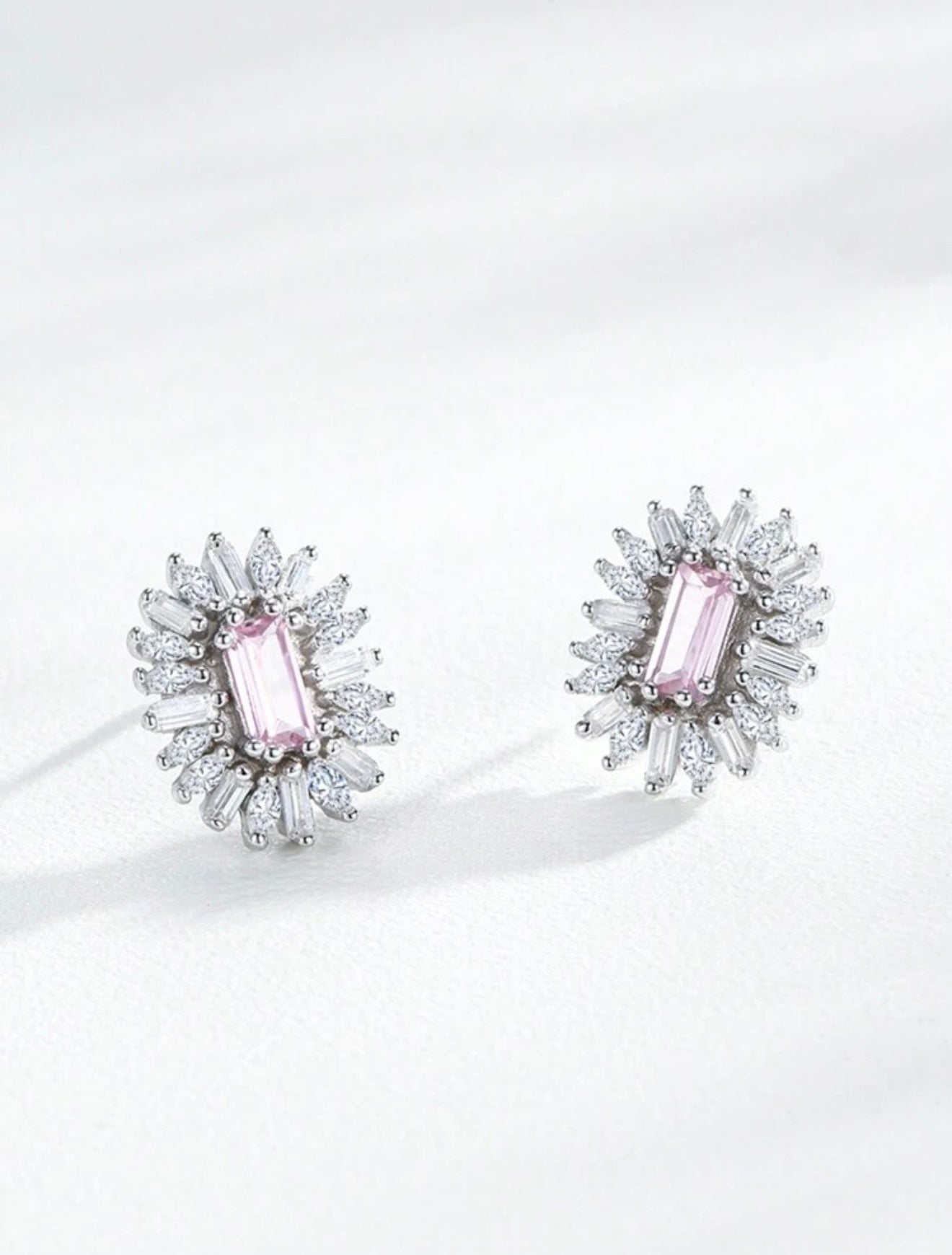 Fashionable luxury 925 sterling silver jewelry with pink sapphire. The set includes a pendant and earrings.