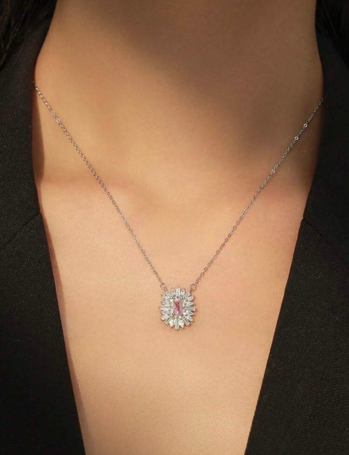 Fashionable luxury 925 sterling silver jewelry with pink sapphire. The set includes a pendant and earrings.