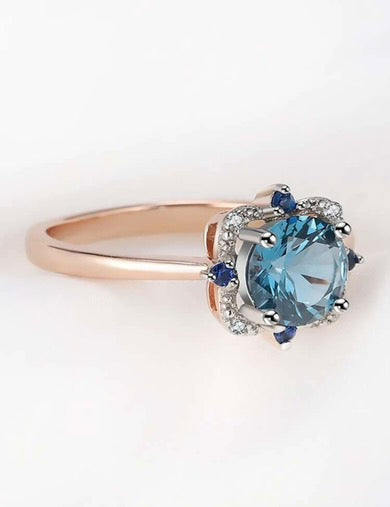 Rings, silver, covered with gold plating. Insert blue round zirconium