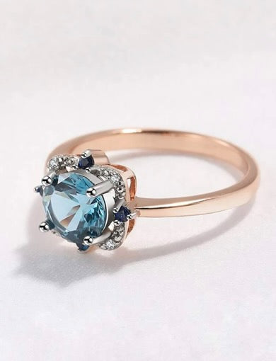 Rings, silver, covered with gold plating. Insert blue round zirconium