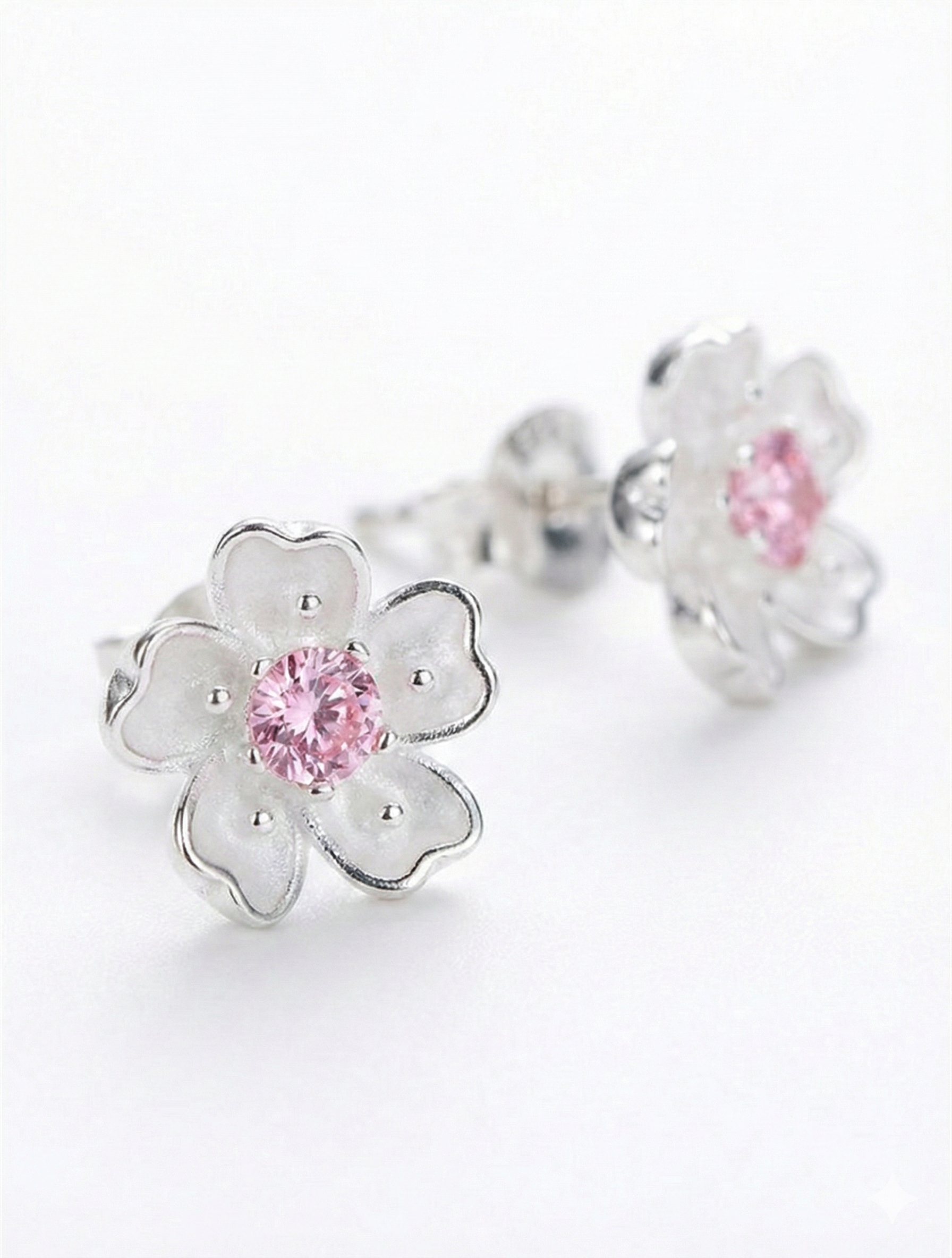 925 sterling silver cherry blossom stud earrings set with a synthetic pink Sapphire