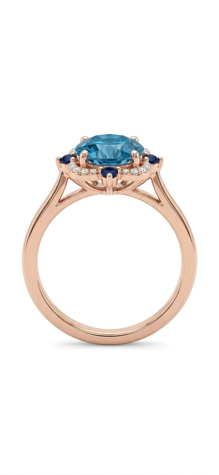 The Marina Bloom gold-plated silver ring is inlaid a round blue lab-grown sapphire